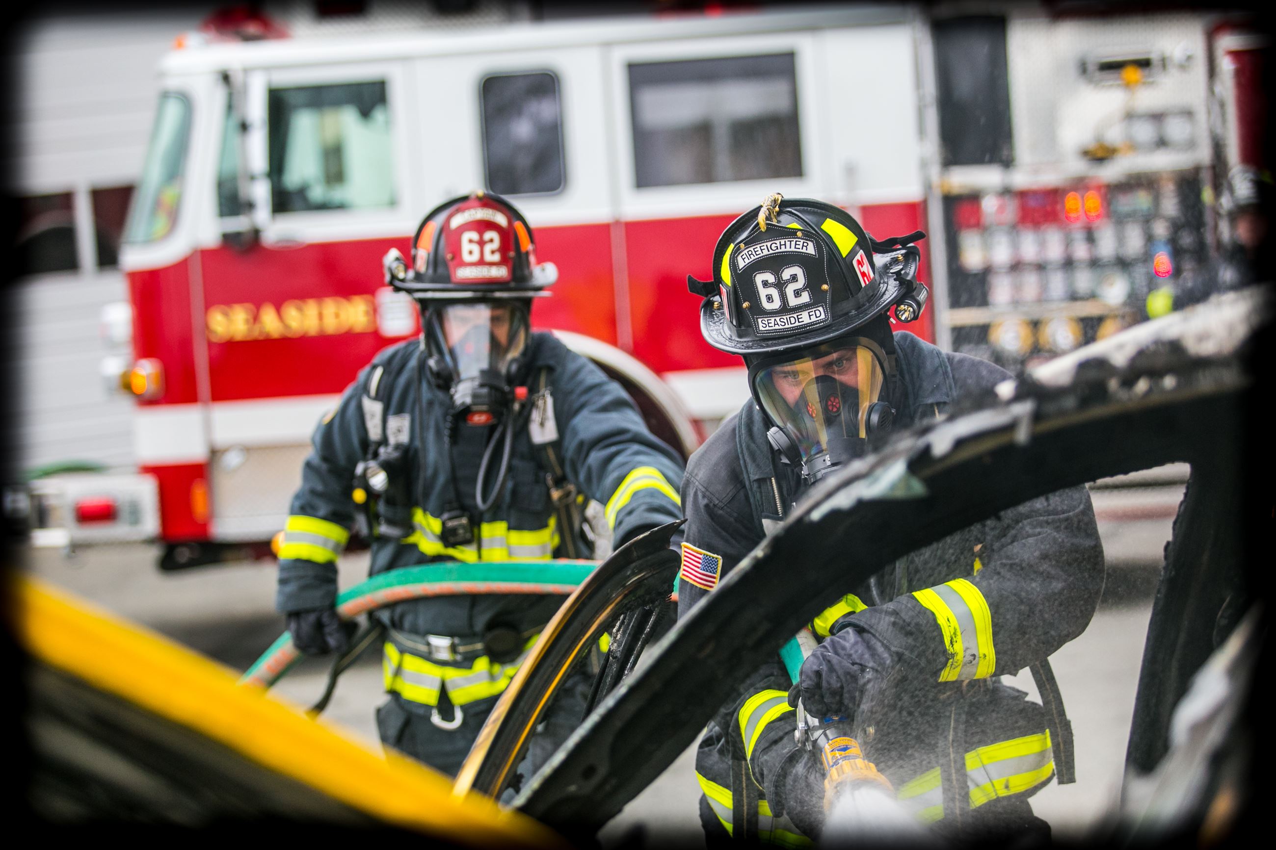 Seaside Firefighters extinguishing vehicle fire
